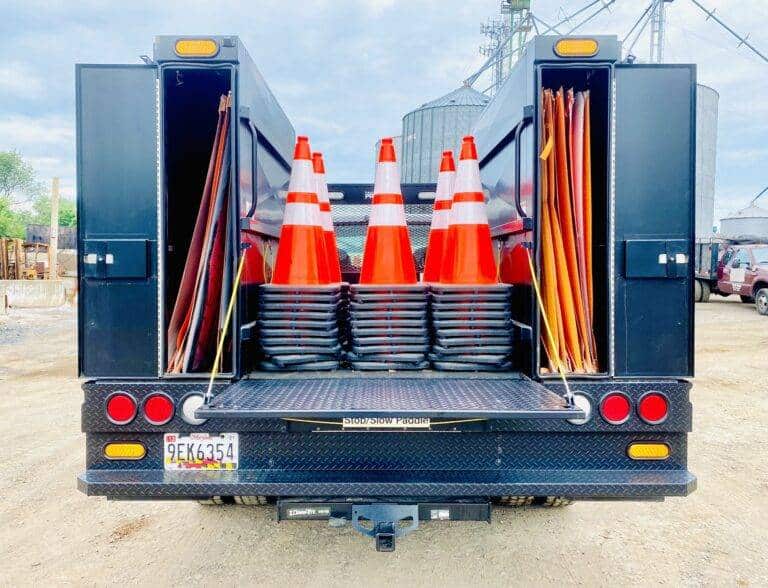 truck with orange traffic cones